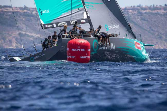 Photo by Keith Brash/Quantum Racing The telltales of a clean leeward mark rounding: a good upwind exit angle, crew on the rail, no ghosts on the foredeck.