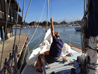 Corine has been working hard to fix some damaged sail hanks on the staysail.