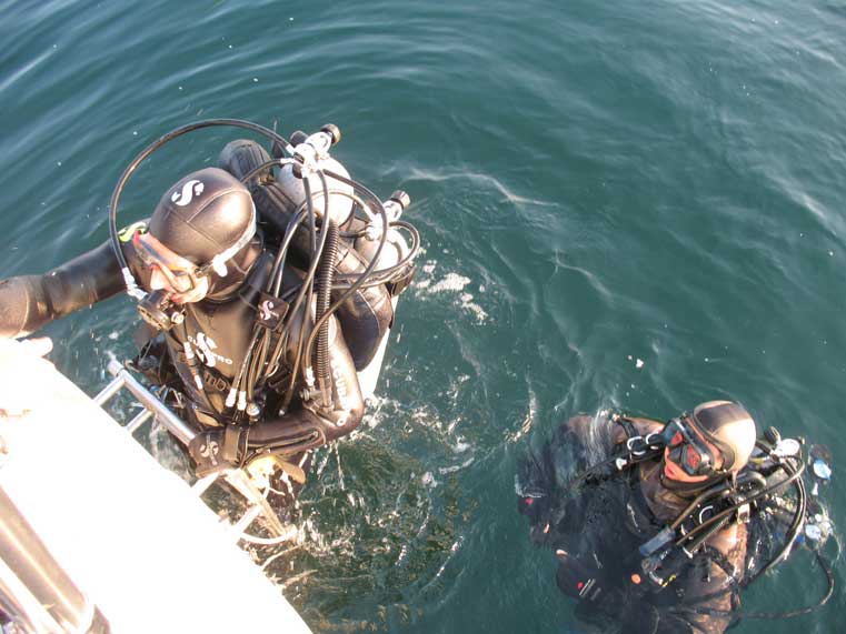 Mike Roth and Nam Sui back at the surface after reinstalling the City Dock race mark.