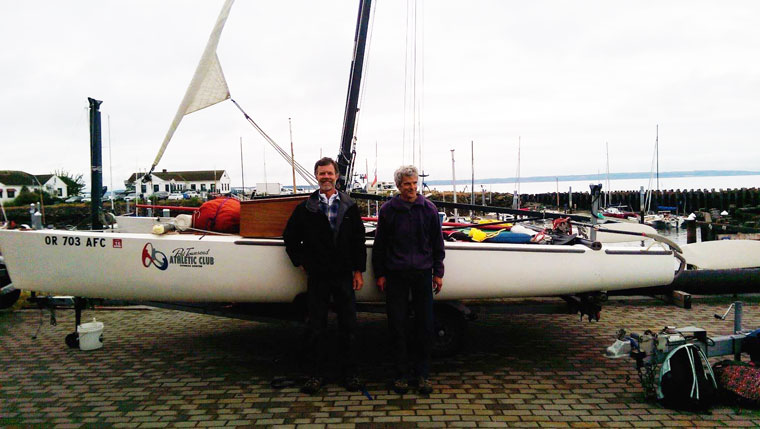 Piper and Norton trying to fix their Hobie 20 for a third time. From R2AK's Facebook page.